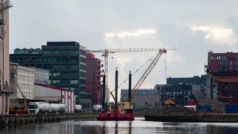 Dynamic Malmo Cityscape Timelapse with Dredging Ship and Cloud Movement Stock Footage 309565680