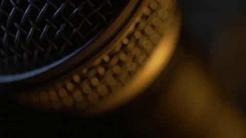 Dynamic microphone with some interesting lighting. Extra close up. Stock Footage 116219039
