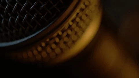 Dynamic microphone with some interesting lighting. Extra close up. Stock Footage 116219196