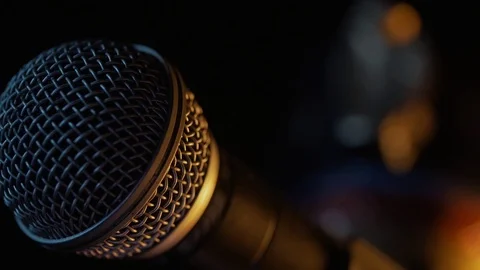 Dynamic microphone with some interesting lighting. Extra close up. Stock Footage 116846126