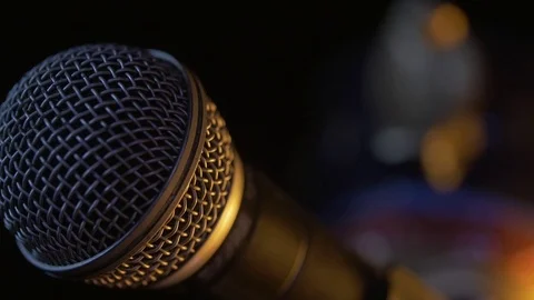 Dynamic microphone with some interesting lighting. Extra close up. Stock Footage 116846518