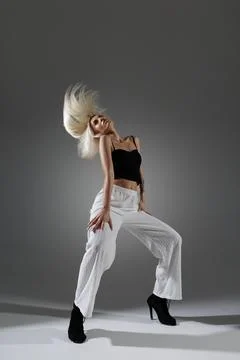 Dynamic Modern Dancer Performing Jazz-Funk Moves in Stylish Outfit Stock Photos