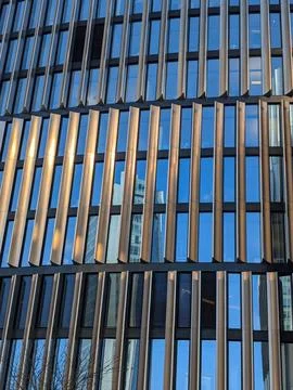 Dynamic Modern Facade Reflects Prague Urban Sky Stock Photos