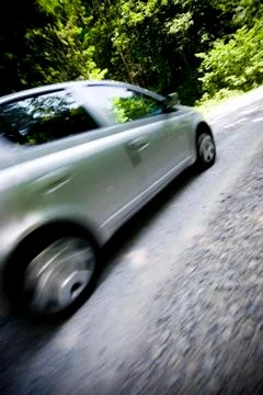 Dynamic motion blur of close car passing by Stock Photos