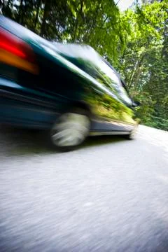 Dynamic motion blur of close car passing by Stock Photos