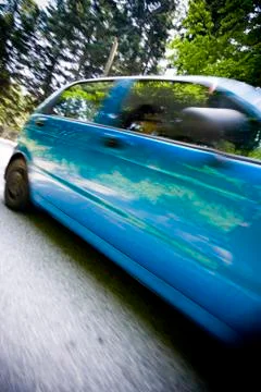 Dynamic motion blur of close car passing by Stock Photos
