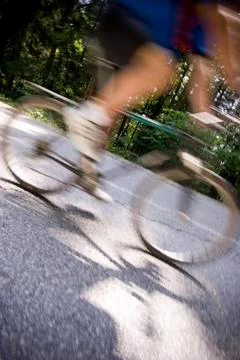 Dynamic motion blur of close racing bicycle passing by Stock Photos
