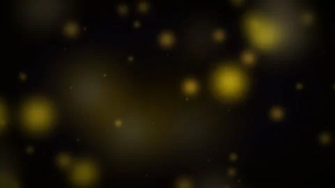 Dynamic motion of glowing yellow particles in a dark background for captiva.. 库存影片 342622649