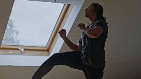 Dynamic Movement in an Engaging Home Workout Session for Optimal Health and Stock Footage 304685149