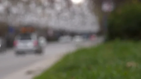 Dynamic movement of vehicles in an urban setting, captured with a blurred visual Stock-Footage 262665199