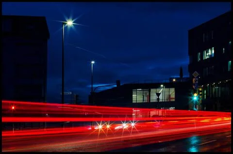 Dynamic Night Cityscape with Red Light Trails and Urban Glow Stock Photos