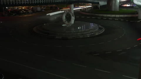 Dynamic night traffic light trails on roundabout. Timelapse of cars fast moving Stock Footage 334764154