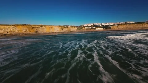 Dynamic ocean scene with waves breaking near shoreline Stock Footage 339787523
