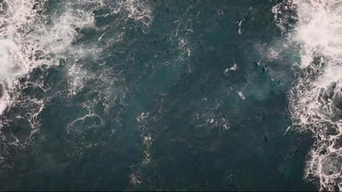 Dynamic ocean surface with white foam and wave patterns Stock Footage 336852830