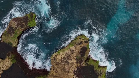 Dynamic Ocean Water Motion Background over Coastal Rocks Stock Footage 329628571