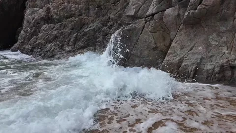 Dynamic Ocean Wave Crashing on Secluded Beach Stock Footage 274259350