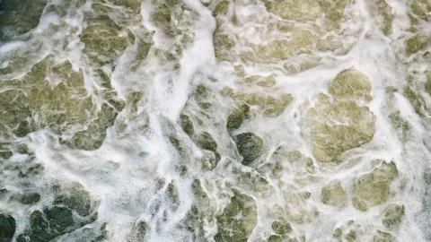 Dynamic Ocean Waves with Beautiful Foam Pattern in a Stunning Coastal Landscape Stock Photos