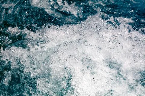 Dynamic ocean waves crash with frothy white spray Stock Photos