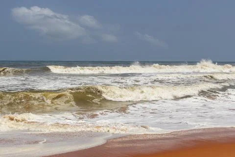 Dynamic Ocean Waves Crashing and Foaming on a Wide Shoreline Stock Photos