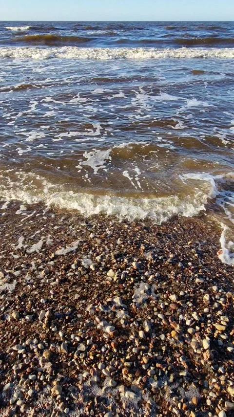 Dynamic Ocean Waves Crashing on Sandy Beach Stock Footage 299719699
