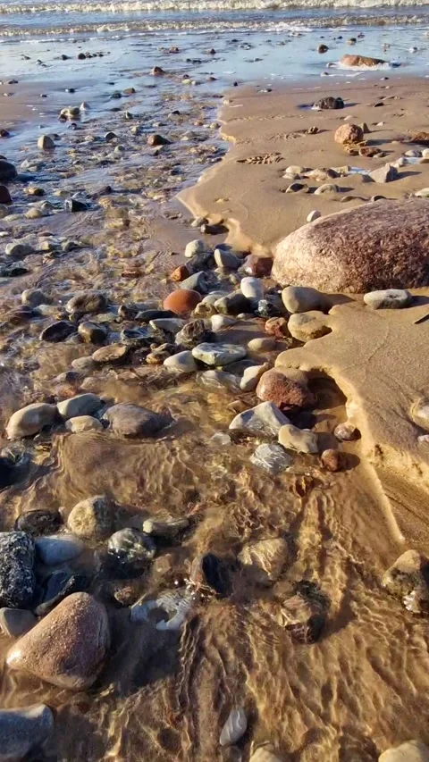 Dynamic Ocean Waves Crashing on Sandy Beach Stock Footage 299719881