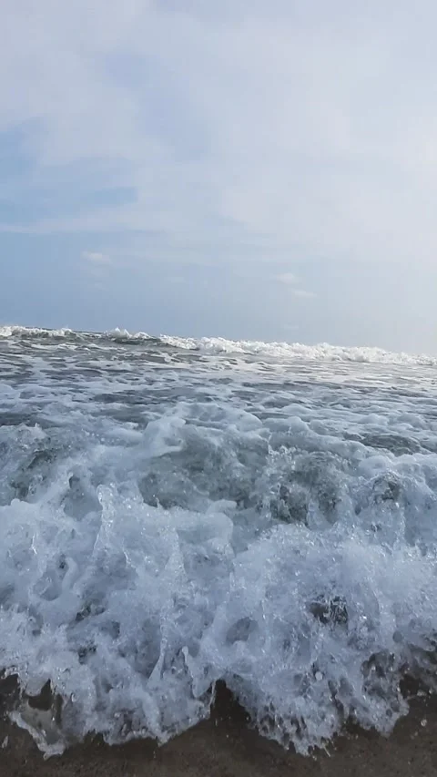 Dynamic Ocean Waves Crashing on Shore Stock Footage 311444899