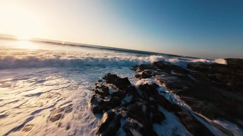 Dynamic ocean waves roll over rocky beach Stock Footage 339788523