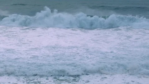 Dynamic Ocean Waves Rolling with Cascading Foam Stock Footage 297468490