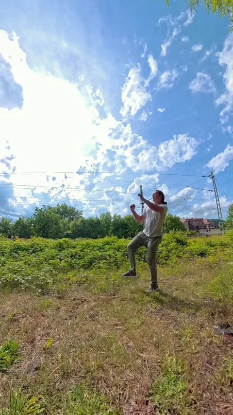 A Dynamic Outdoor Action Shot Capturing a Strikingly Impressive Kick Technique Stock Footage 311447780