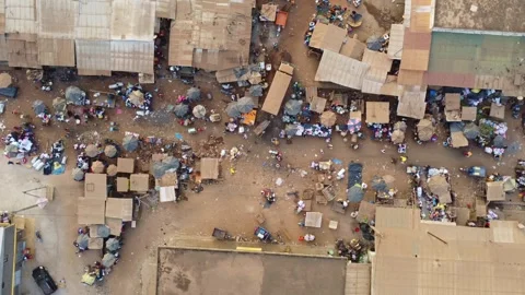 Dynamic Overhead View Captures Bustling Marketplace Scene with Makeshift Stalls Stock Footage 316190309