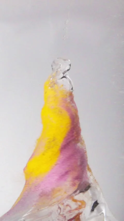 Dynamic Pink Yellow Powder Vortex Peak Spinning Underwater Splash Vertical Stock Footage 336590696