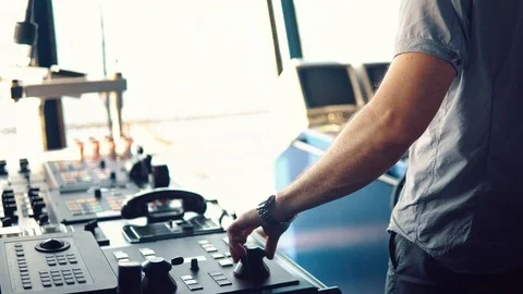 Dynamic positioning officer operationg bridge ship equipment of vessel Video stock 108946046
