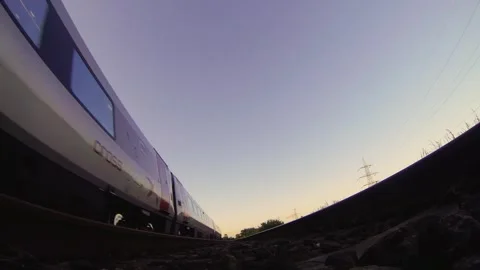 Dynamic POV GoPro Footage Capturing a Train Speeding Overhead on Tracks Stock Footage 297370820