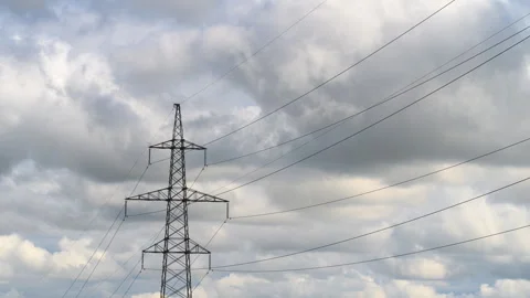 Dynamic Power Lines Set Against a Dramatic Cloudy Sky Filled with Various Textur Stock Footage 316383106