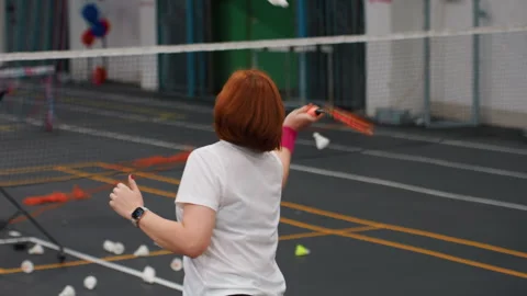 Dynamic practice session with coach in lively gym environment. Women with Stock Footage 341768258
