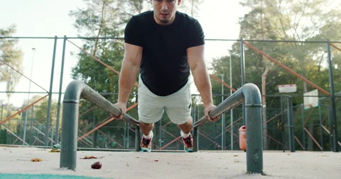 A Dynamic PushUp Workout outdoors offers many benefits for overall health and Stock Footage 317756510