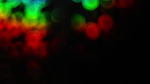 Dynamic rainbow circular bokeh lights moving across a dark abstract backgro.. 스톡 동영상 341324842