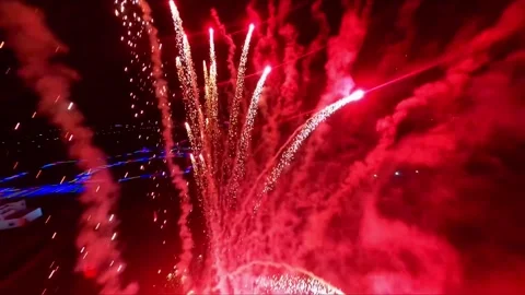 Dynamic Red Fireworks Exploding in Night Sky Wide Angle Stock Footage 319611515