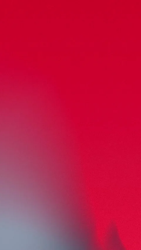 Dynamic red gradient seamlessly blending with soft gray tones in 4K. Vídeo Stock 309855950