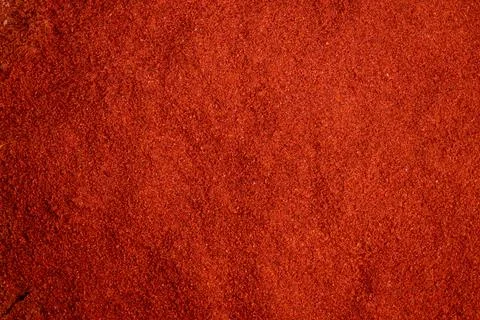 Dynamic red paprika texture with bold sprinkled granule pattern, Vivid and textu Stock Photos