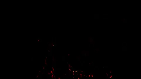 Dynamic red sparks ascending on black background in seamless loop Stock Footage 327568840