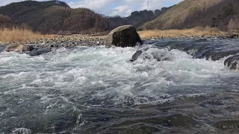 Dynamic River Water Flowing Through Rocks in South Korea Stock Footage 330855391