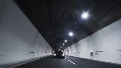Dynamic rolling shots of Lamborghini huracan driving at high speed in a tunnel Video stock 330956420