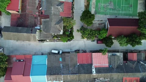 Dynamic Rooftop Mosaic: An Elevated Perspective of a Bustling Residential C.. Video stock 339037644