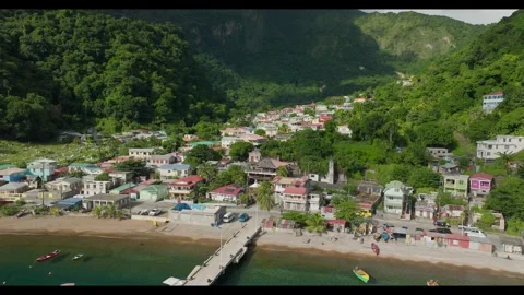 Dynamic rotating reveal of the Soufriere Valley and shoreline Dominica Stock Footage 283395498