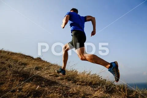 Dynamic running uphill Stock Photos
