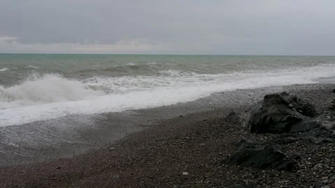 Dynamic Sea Waves Crashing on a Pebble Shore Stock-Footage 330311249