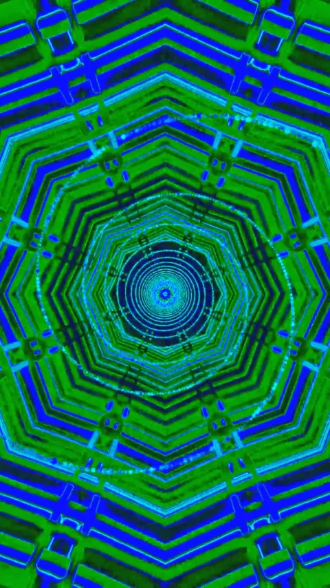 Dynamic seamless tunnel video loop featuring vibrant blue and green geometr.. Stock Footage 321571710