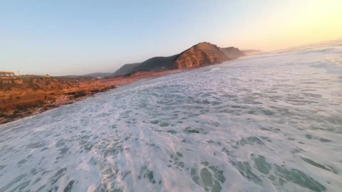 Dynamic seascape featuring powerful waves breaking on cliffs Vídeo Stock 346370724
