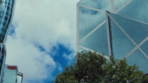 A dynamic sequence showcasing modern skyscrapers in Hong Kong viewed from low Stock Footage 338311528